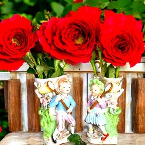 I find rare period year 1939: couple of antique German porcelain vase statues